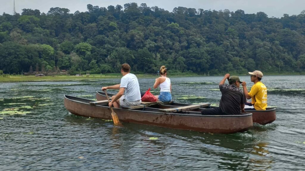 canoe paddling at tamblingan lake nature tour